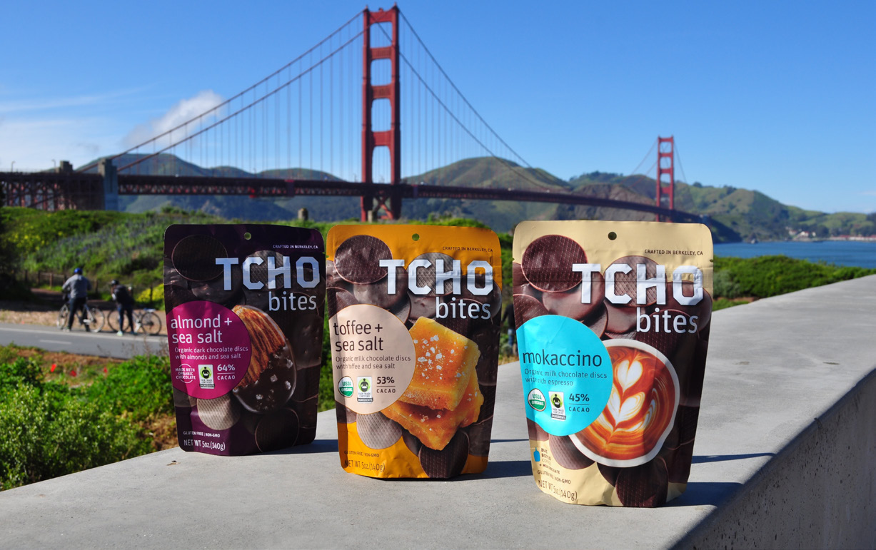 photo of TCHO chocolate product packages outdoors with Golden Gate Bridge in background