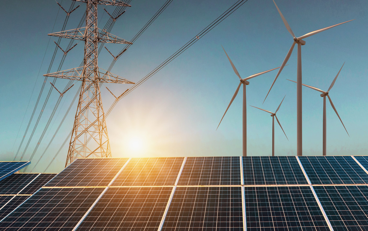 solar panels and wind turbines at sunset, manufacturing facility exterior photo