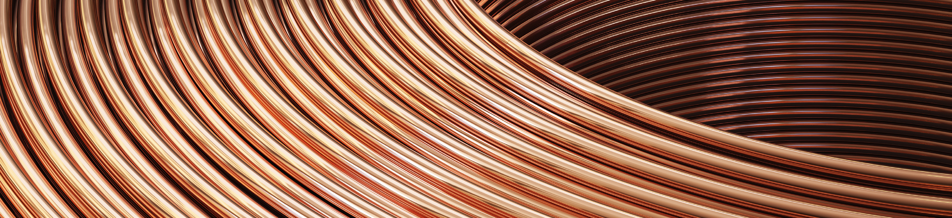 close-up photo of coiled copper tubing with warm lighting