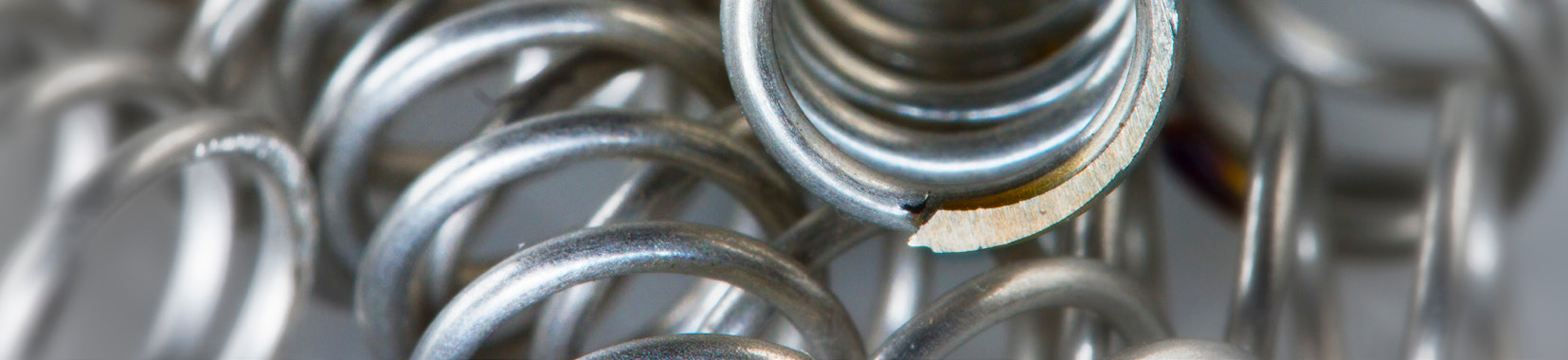 close-up photo of metal springs in a manufacturing setting