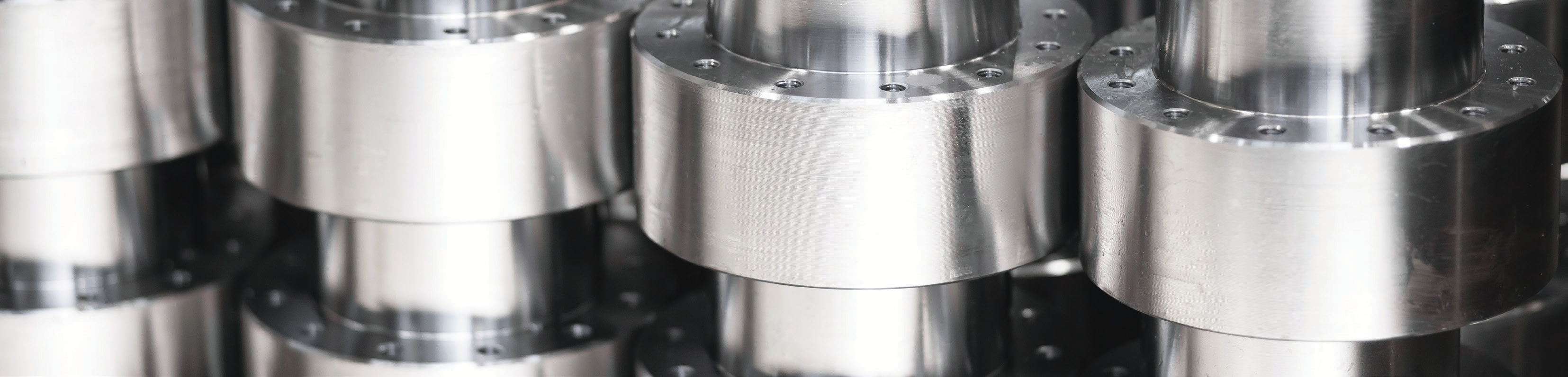 close-up photo of metal stamping machine parts in silver steel