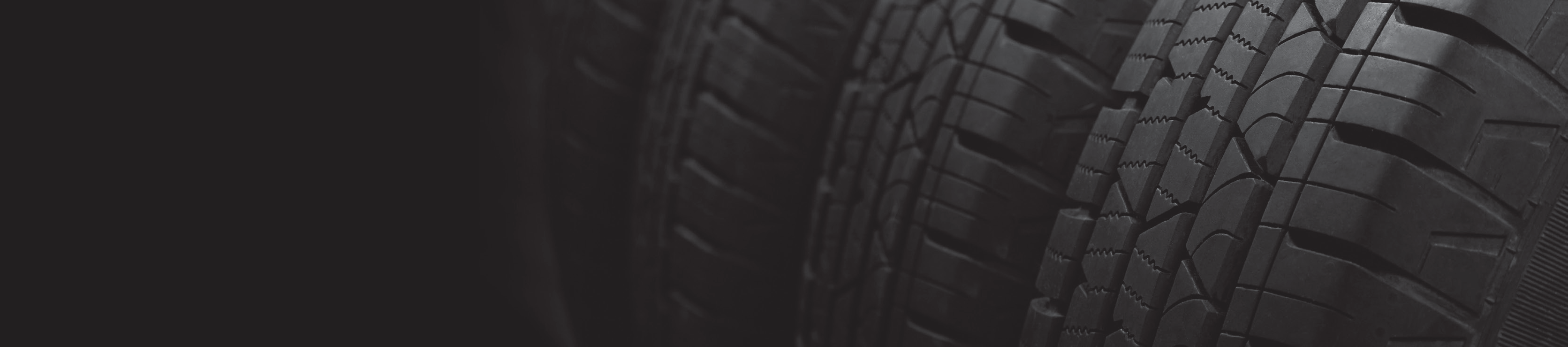 close-up photo of stacked tire treads in a dark manufacturing environment