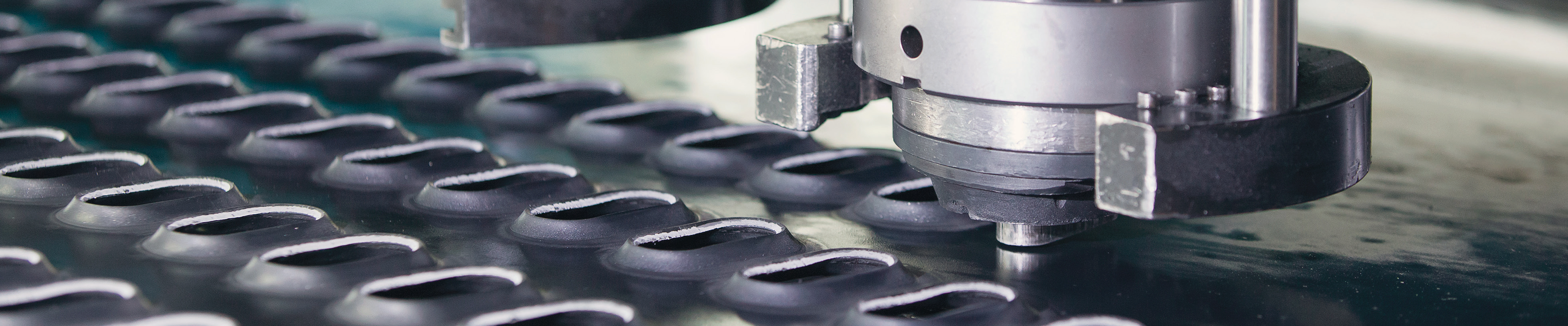 manufacturing facility production line close-up photo with metal parts and machinery