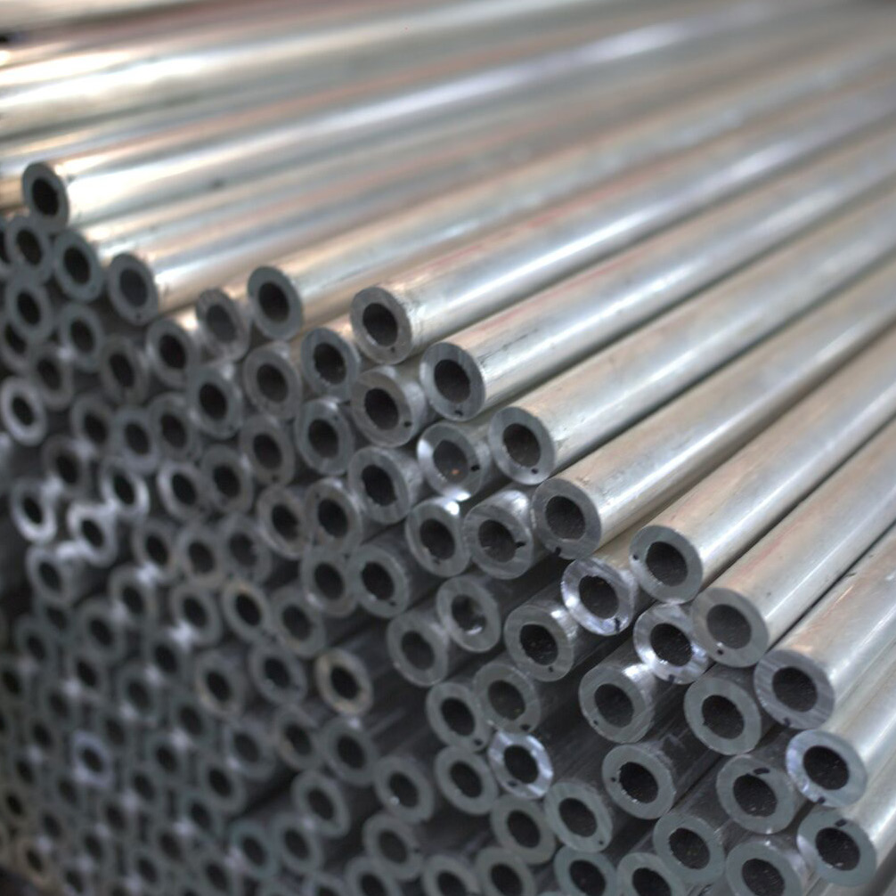 close-up photo of stacked metal tubes with hollow centers