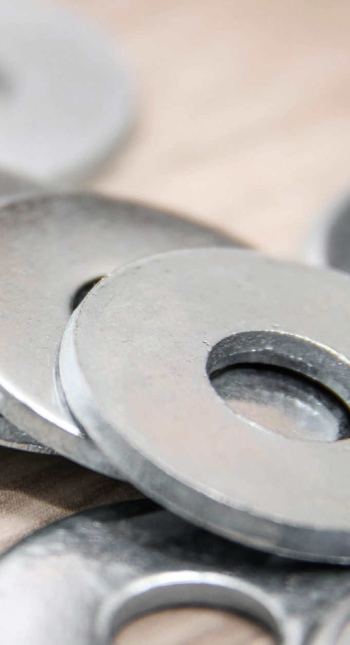 Close-up photo of metal parts with circular shapes and a metallic finish
