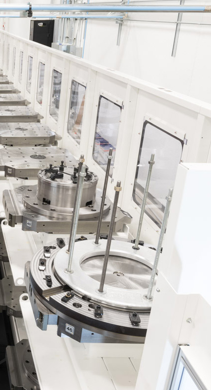 manufacturing facility interior photo with machinery and equipment in white and metallic colors