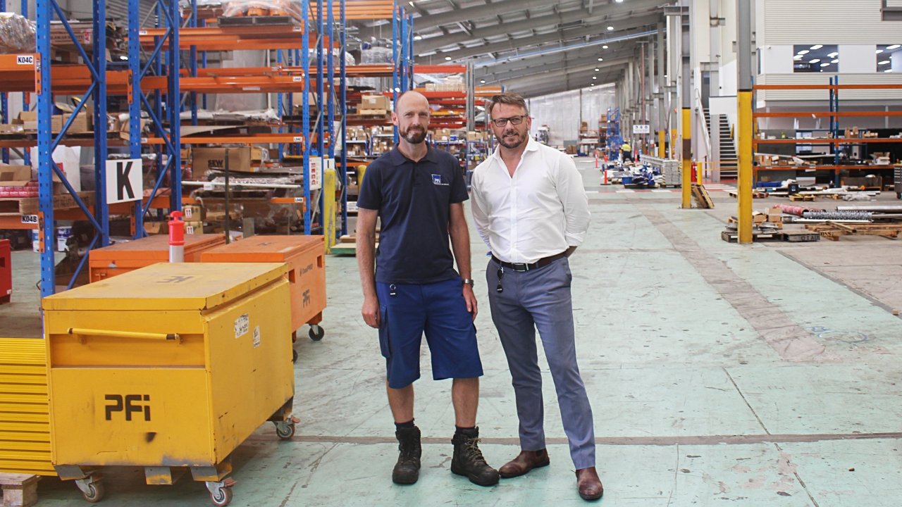 PFi Managing Director Gavin Dunwoodie, right, with Senior Automation Engineer Jon Watson, left, in their 11,000 square metre facility in Darra, Queensland