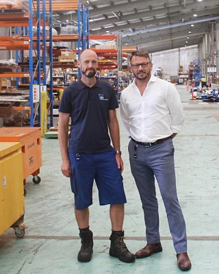 PFi Managing Director Gavin Dunwoodie, right, with Senior Automation Engineer Jon Watson, left, in their 11,000 square metre facility in Darra, Queensland