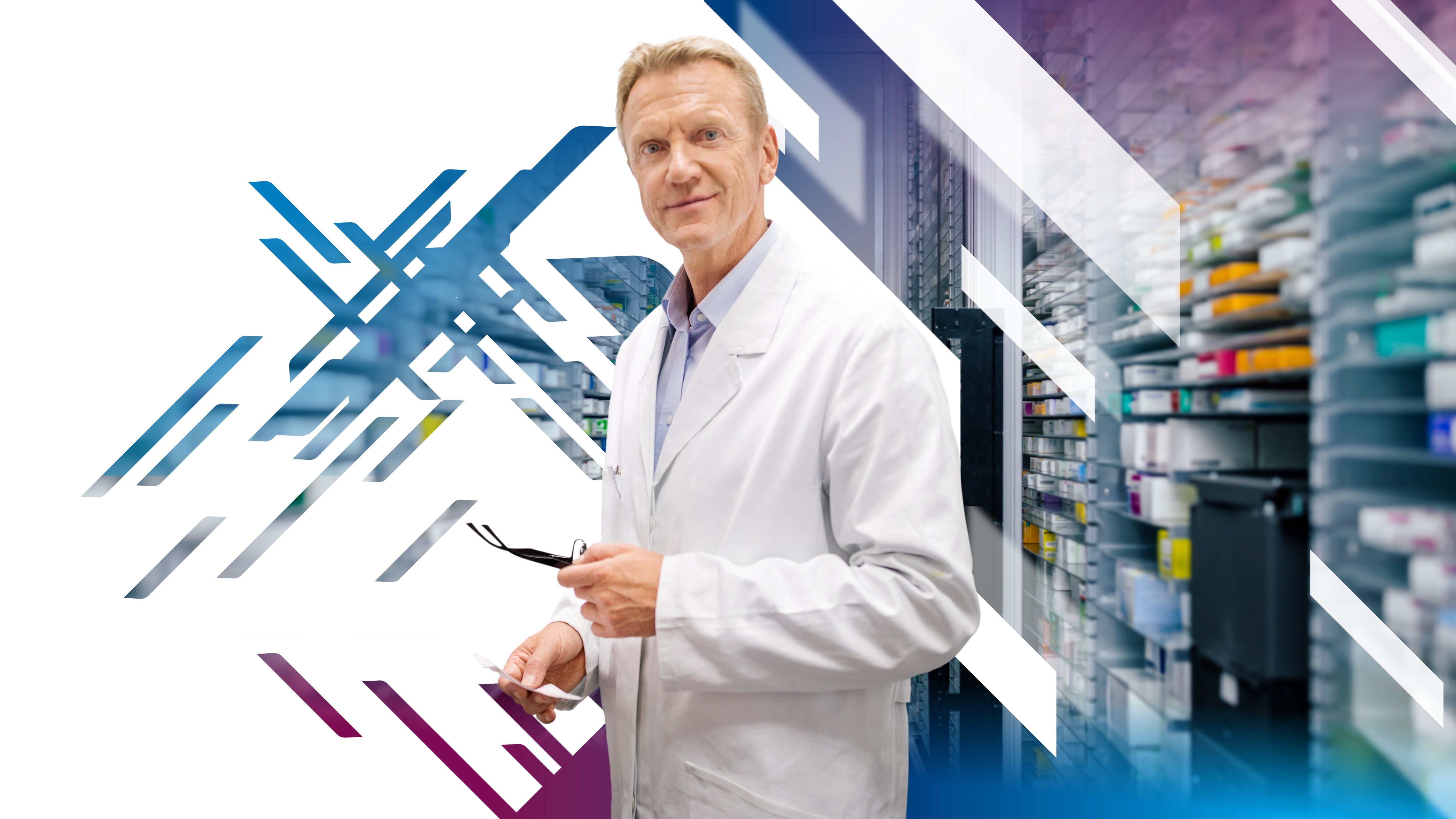 Man in white standing in front of medical cabinet