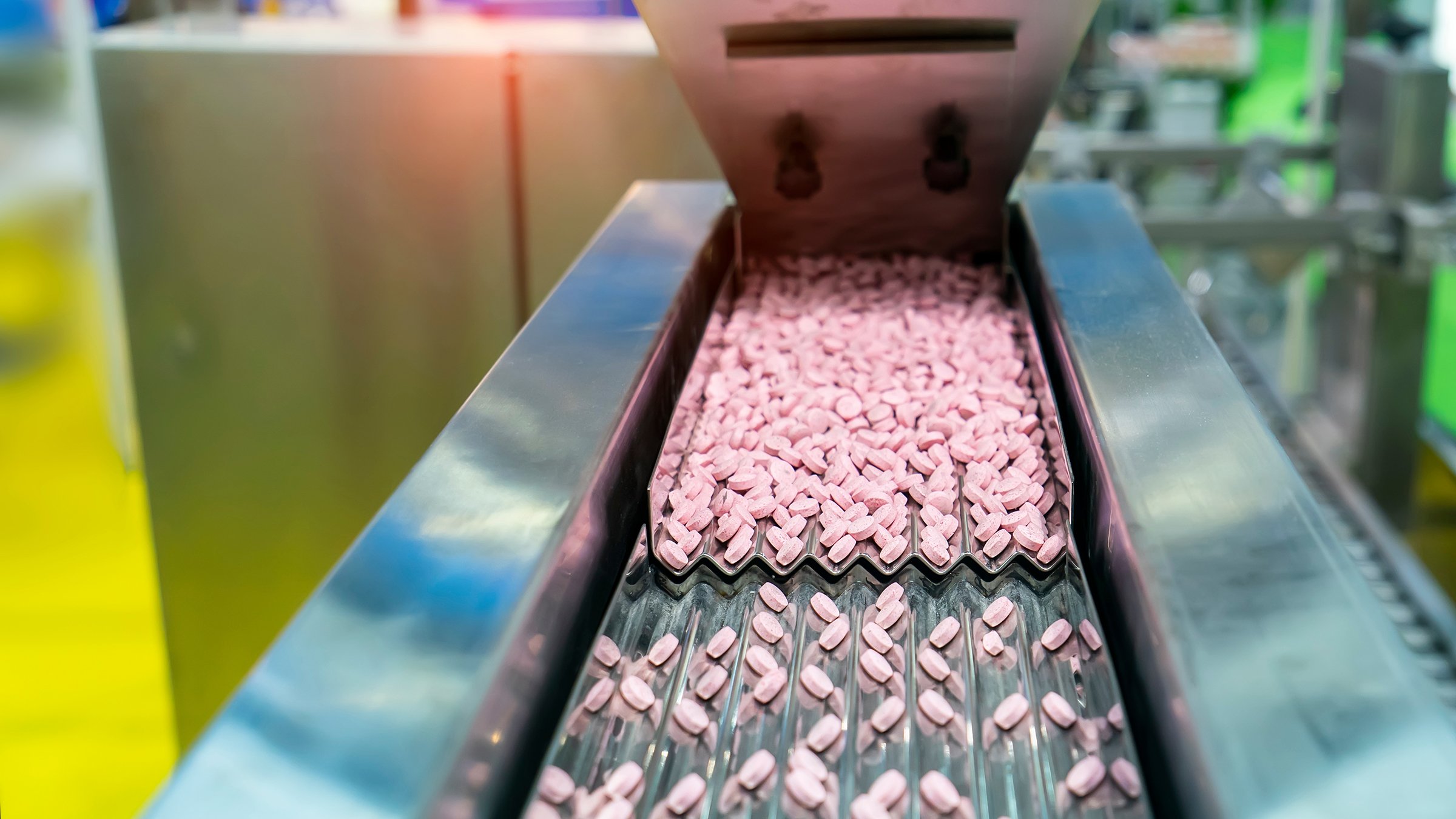 Pills on conveyor in a pharaceutical production plant