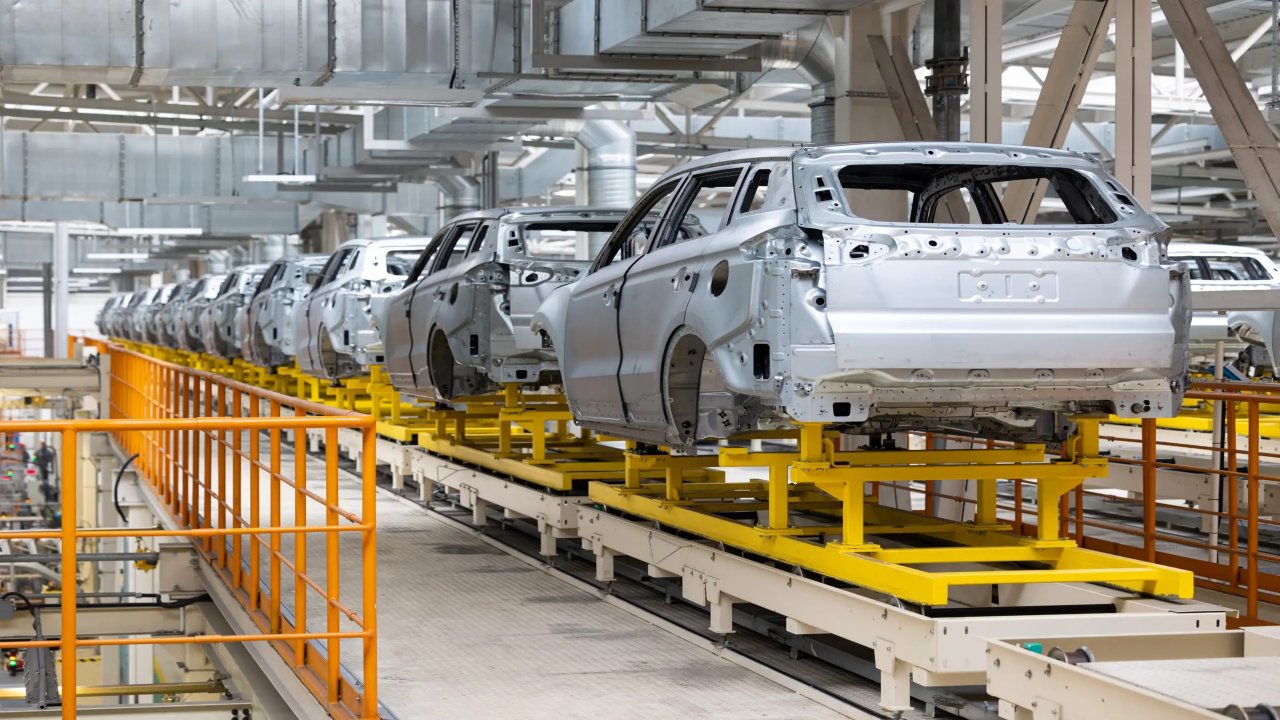 Photo of automobile production line. Welding car body. Modern car assembly plant. Auto industry.