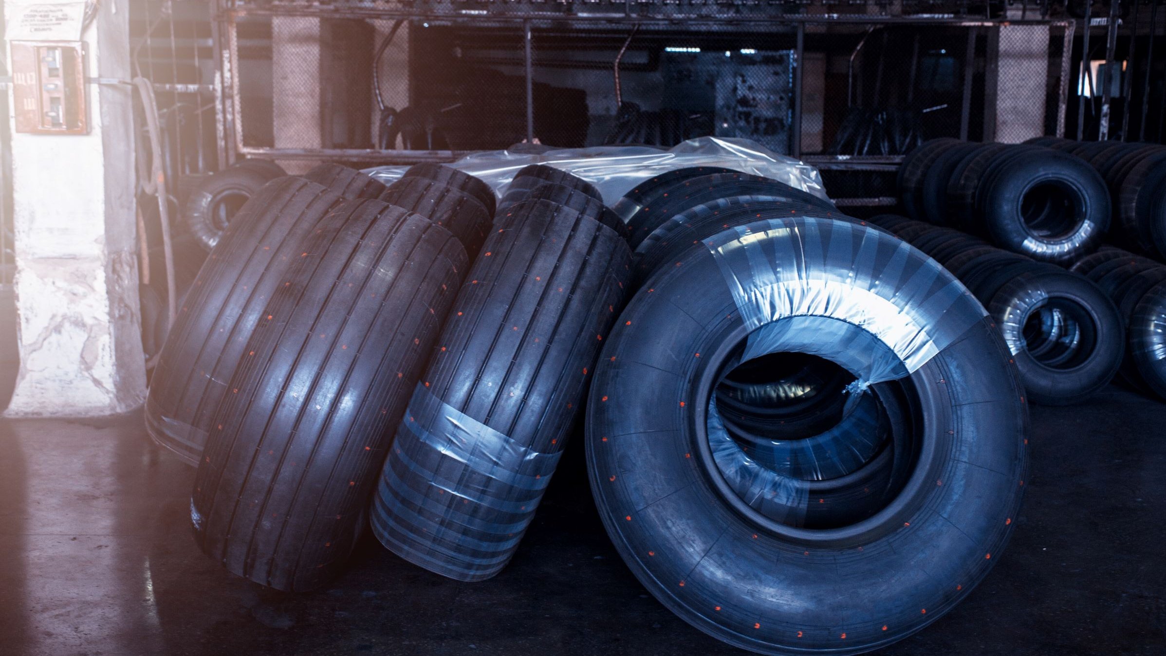 Pile of tires in warehouse or shop environment