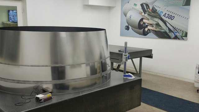 quality-control-room-with-metal-equipment-and-aerospace-photograph