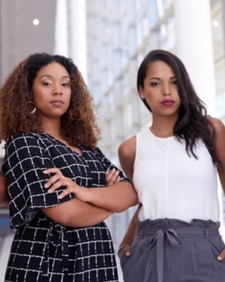 Portrait of a group of young businesswomen working together in a modern office