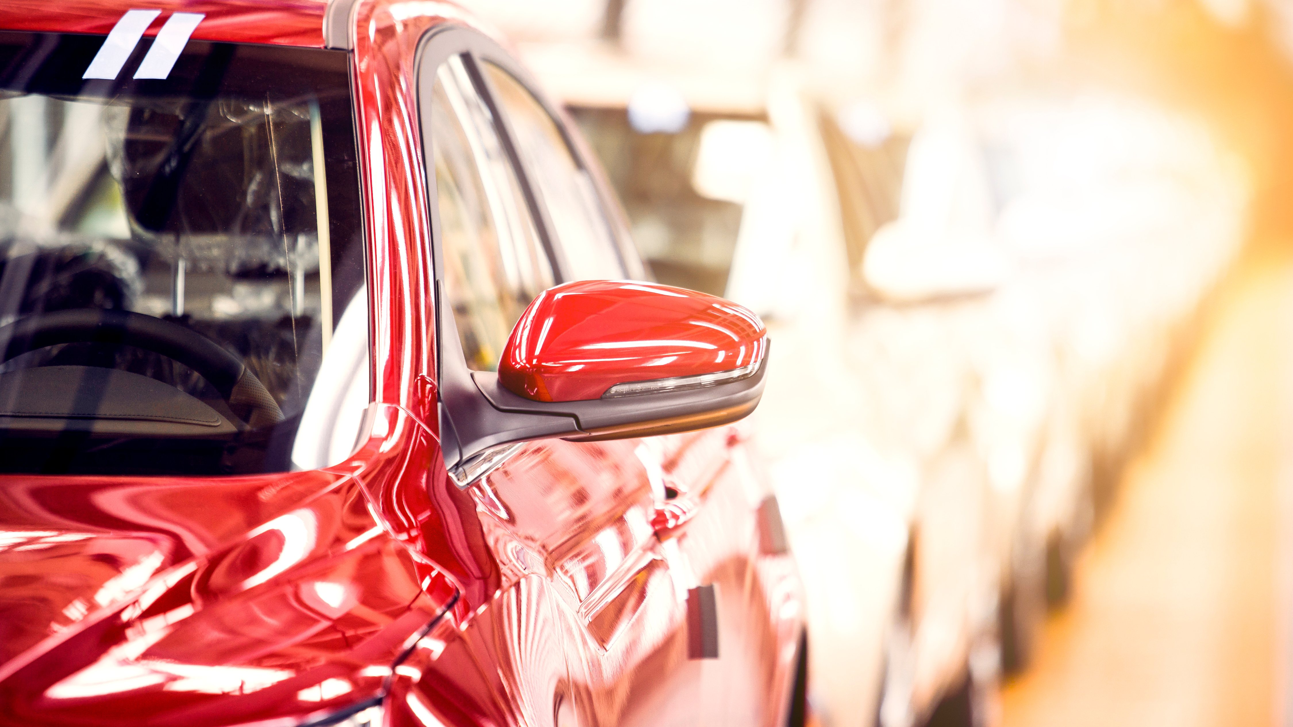 Red car on assembly line