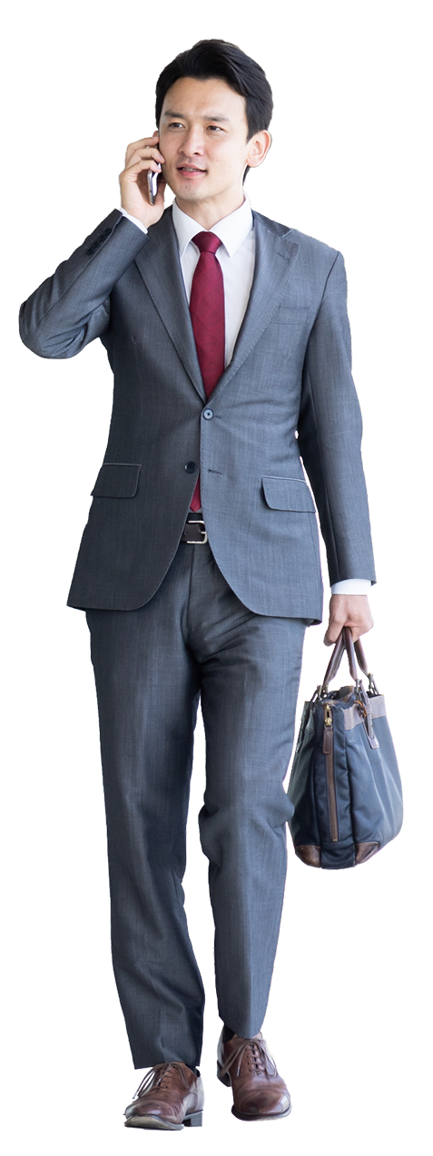 Businessman walking on phone