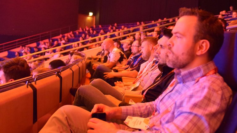 Customer sitting in the big auditorium