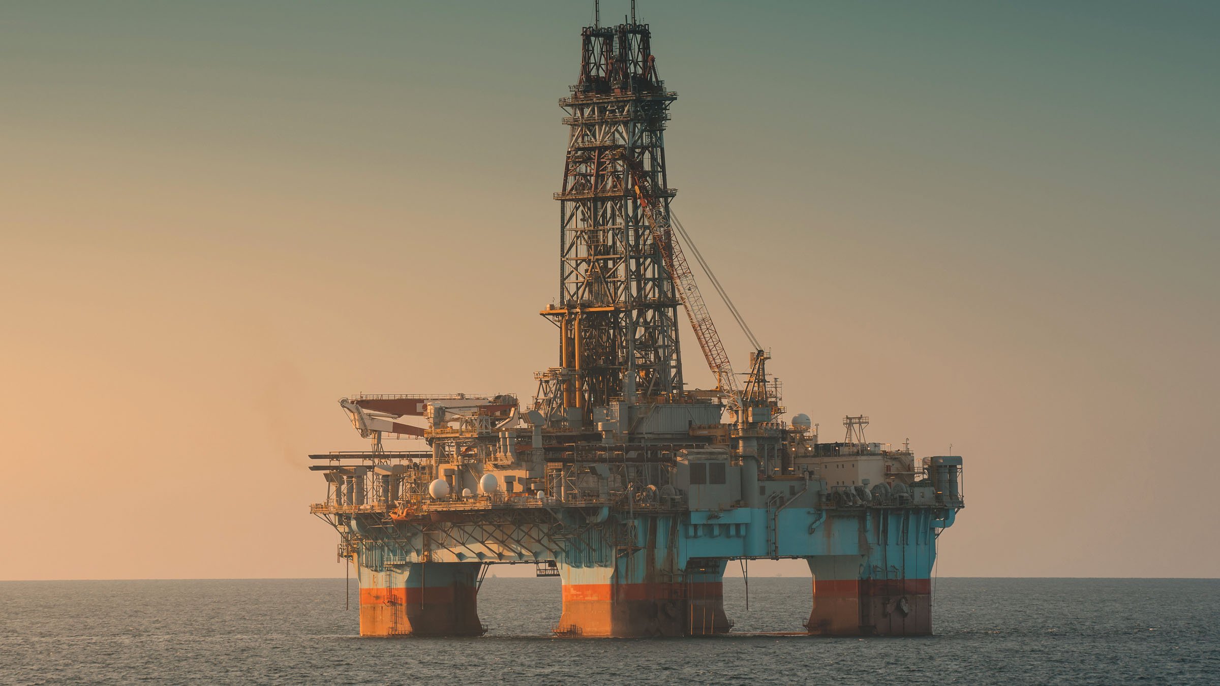 Semi-submersible oil rig in the ocean doing drilling.