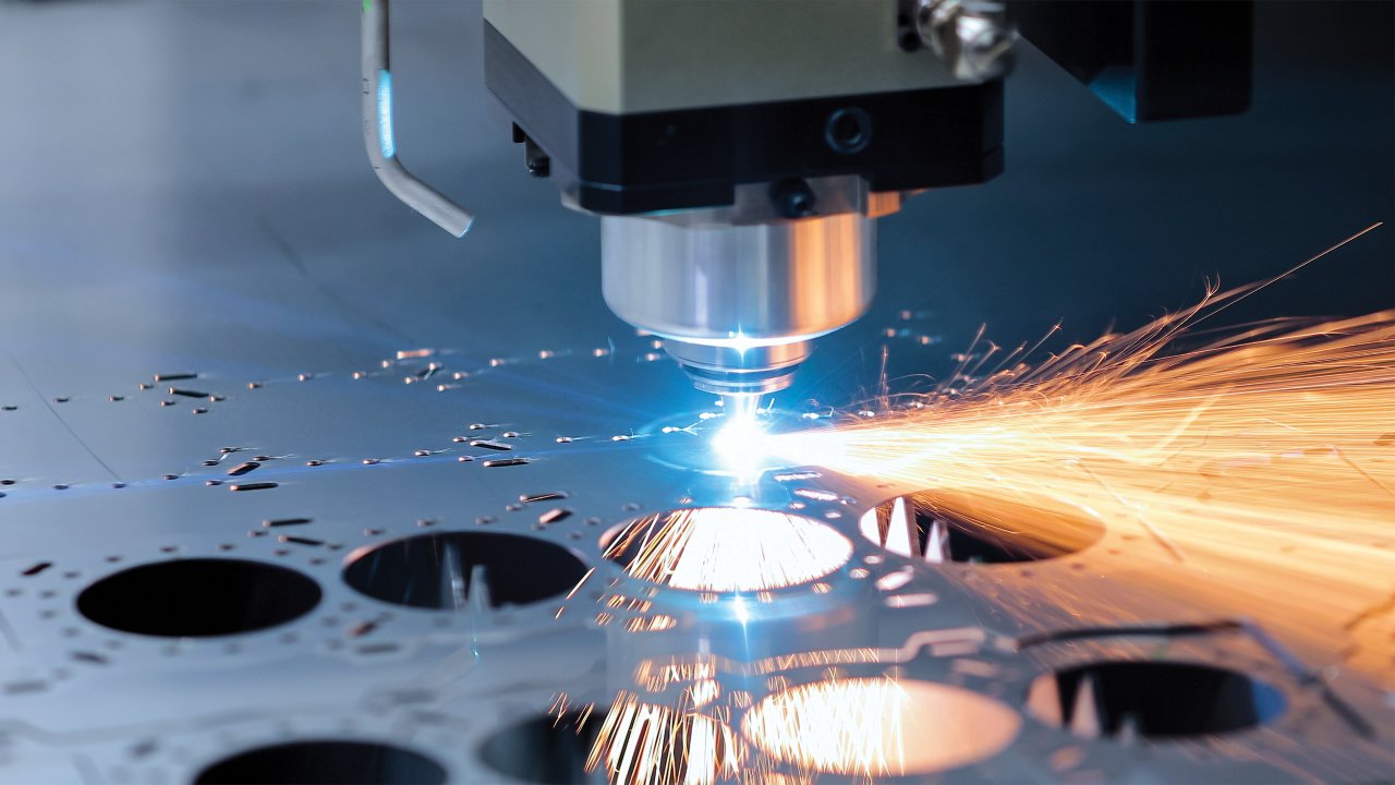 Sheet metal laser cutting machine throwing sparks.