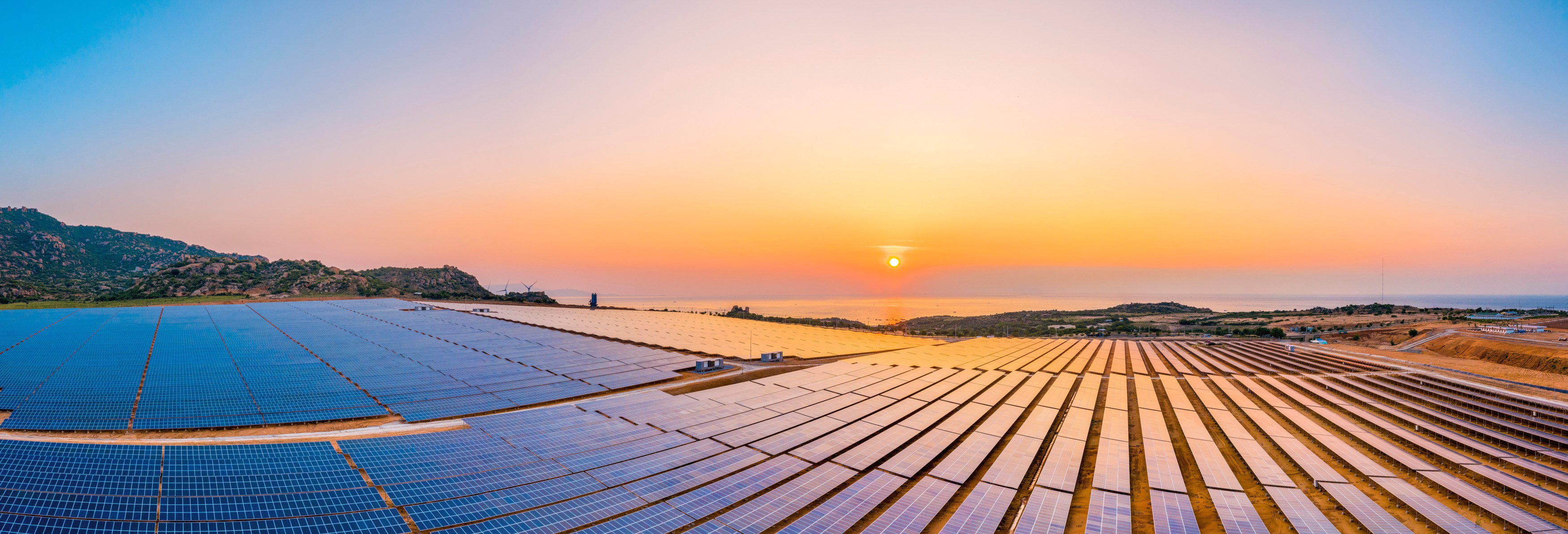 Aerial view of Solar panel, photovoltaic, alternative electricity source - concept of sustainable resources on a sunny day, Phuoc Dinh, Ninh Phuoc, Ninh Thuan, Vietnam