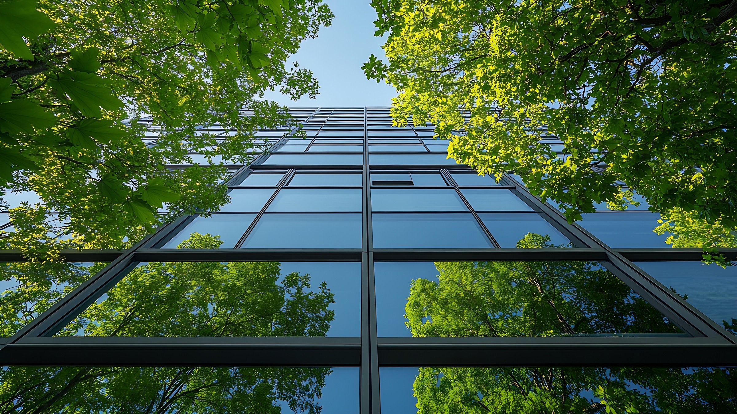 Sustainable green building Ecofriendly building Sustainable glass office building with trees for reducing carbon dioxide Green company office with green environment Corporate building