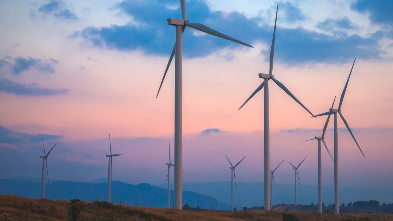 Group of Wind turbines in sunset 