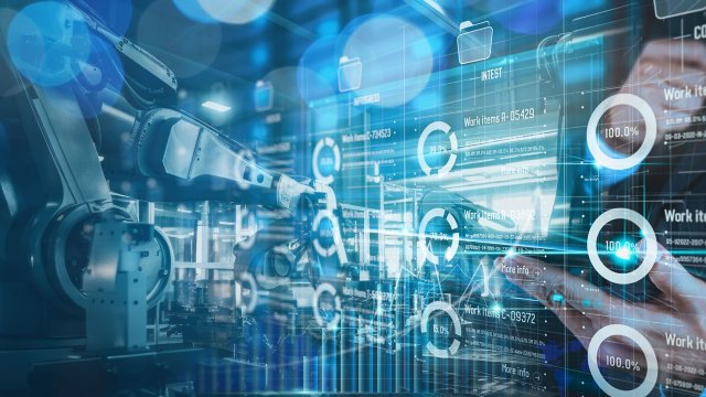 Engineer manager analyzing and control automation robot arms machine on software modern virtual interface data real time in intelligent factory industrial and digital manufacturing operation.