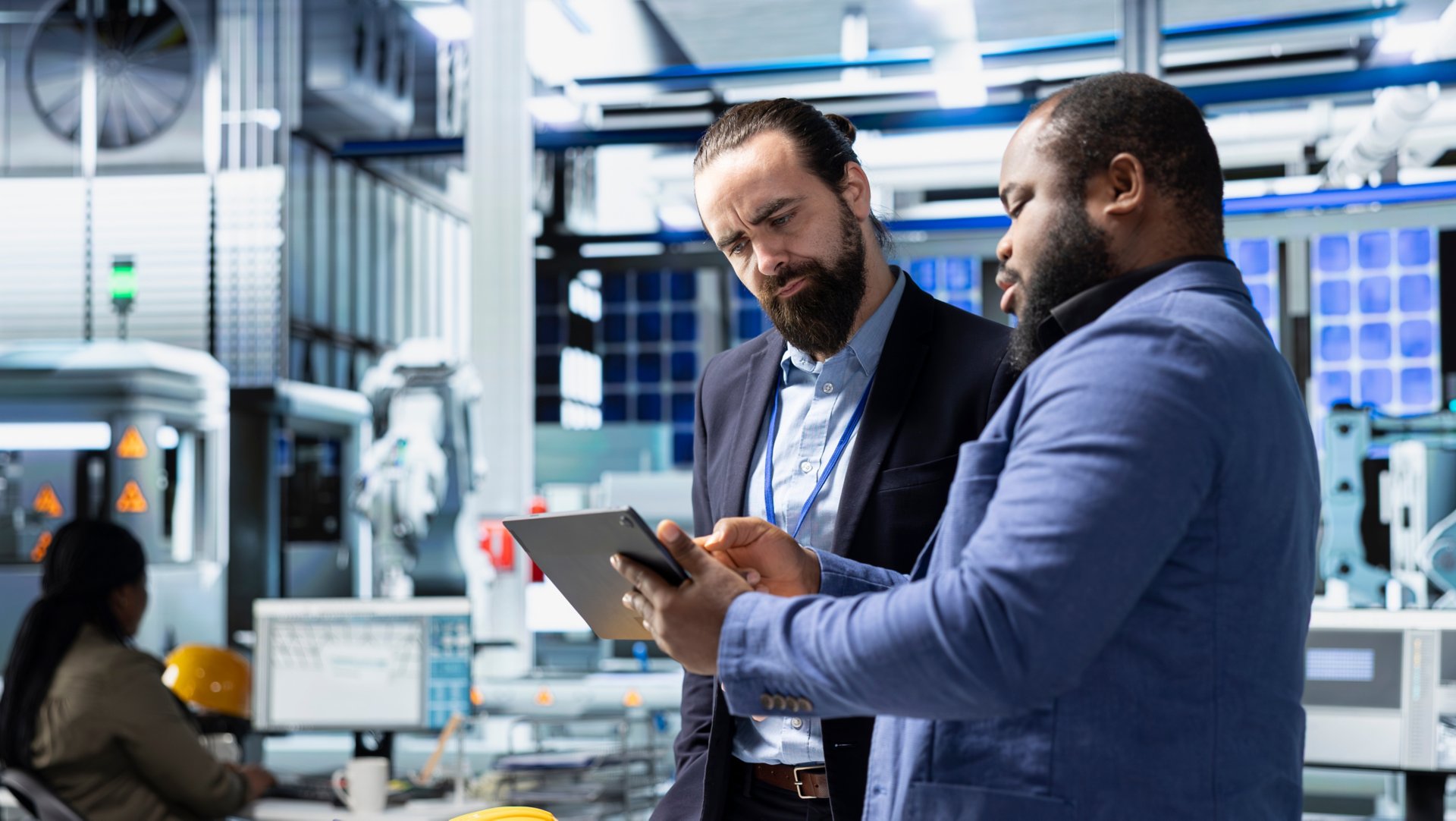 Multiethnic specialists engineers doing teamwork on modern production line for solar panels power, combining technical insight and collaboration for renewable energy infrastructure.