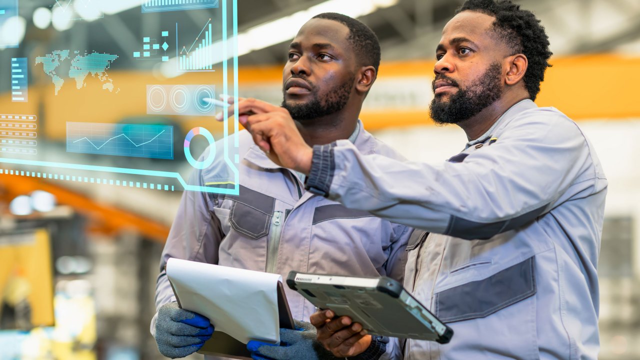 Two male engineers looking into technology data