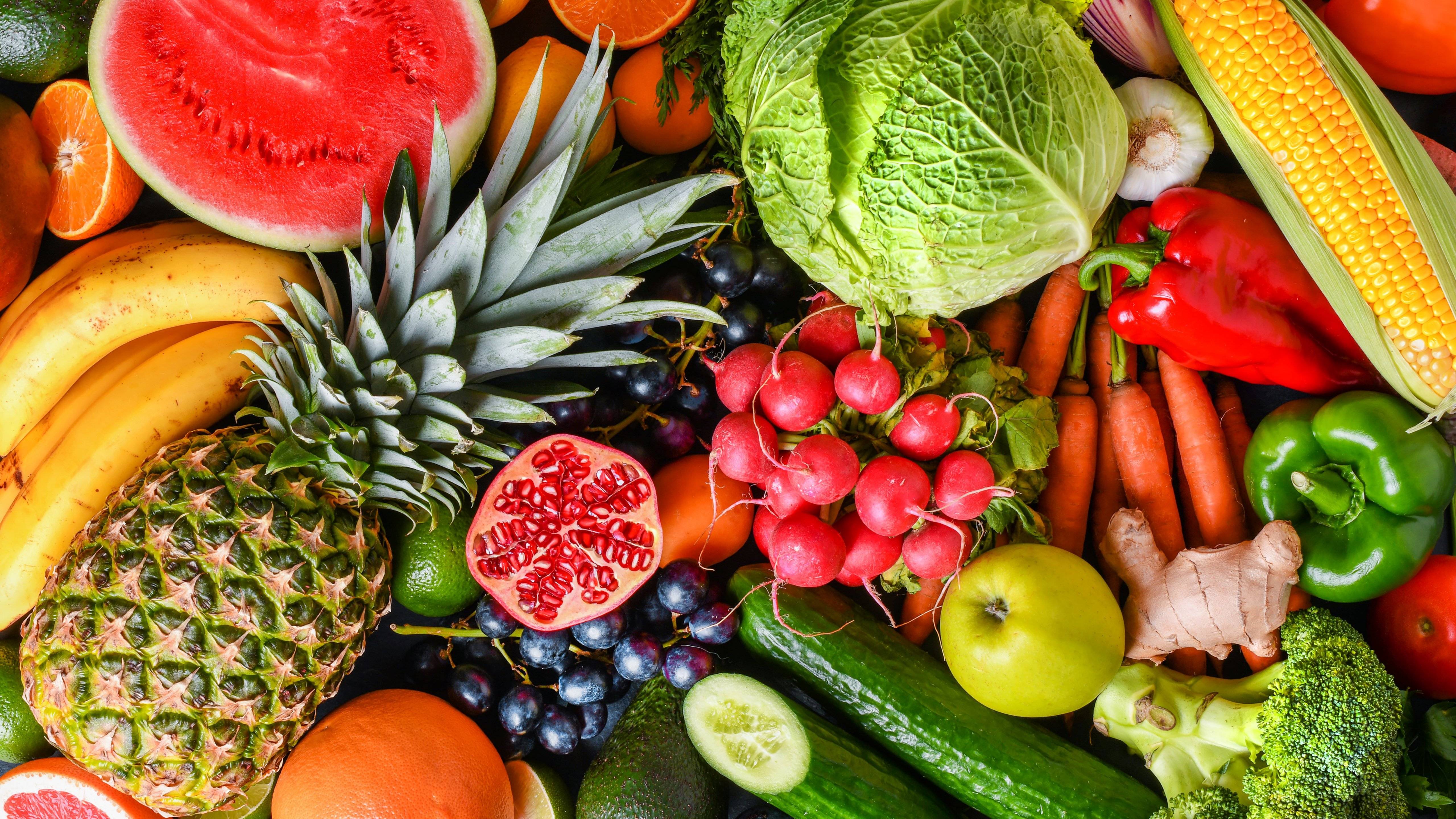 A variety of fresh fruits, healthy vegetables top view. Large vegetable food and citrus mix collection.