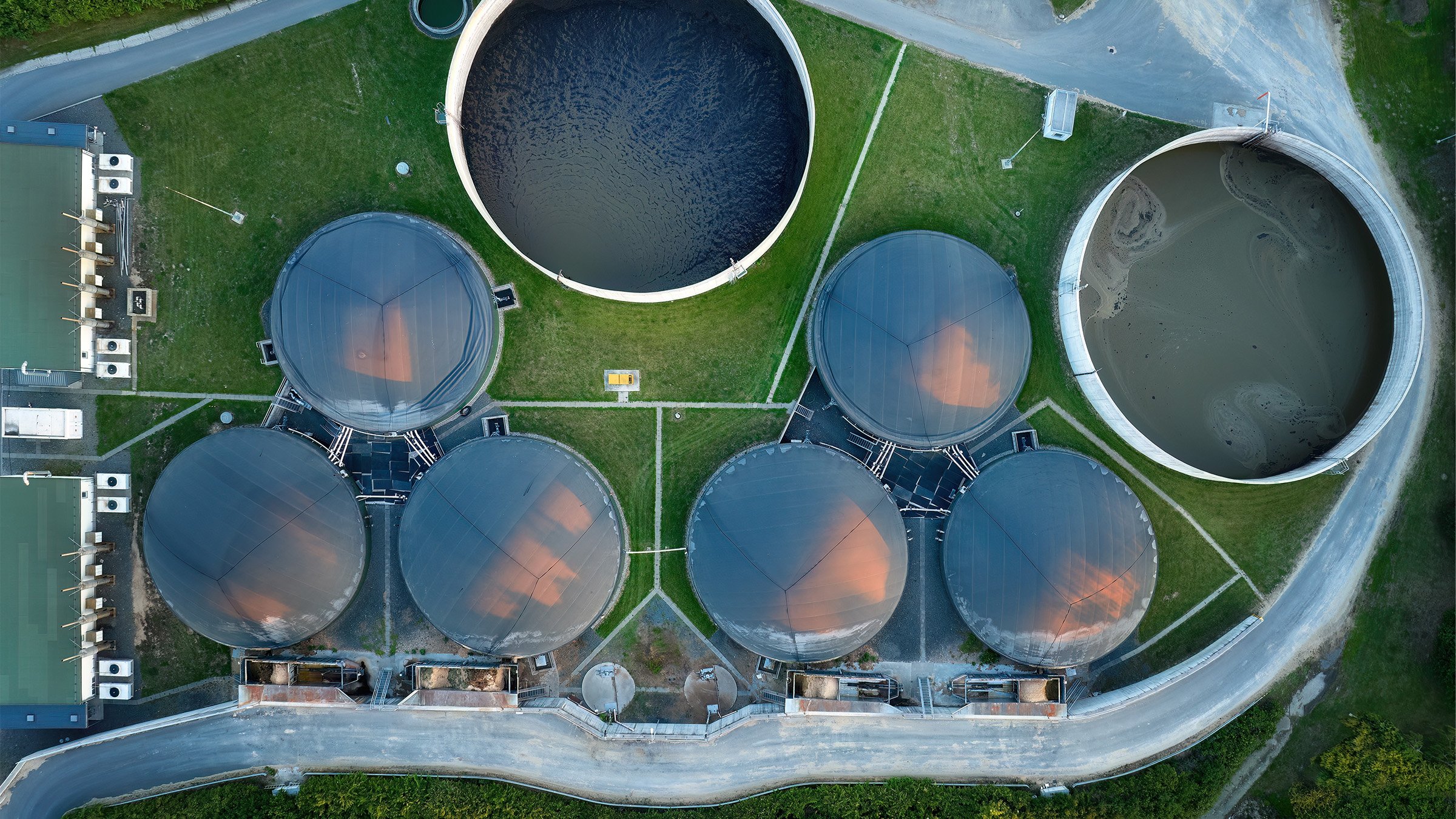 Vertical view of fermenters and biogas storage tanks of the agricultural biogas plant for electricity and heat production.