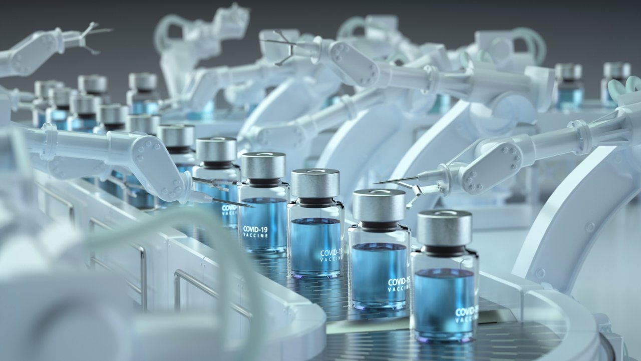 Digital generated image of COVID-19 vaccine bottles standing on robotic production line.