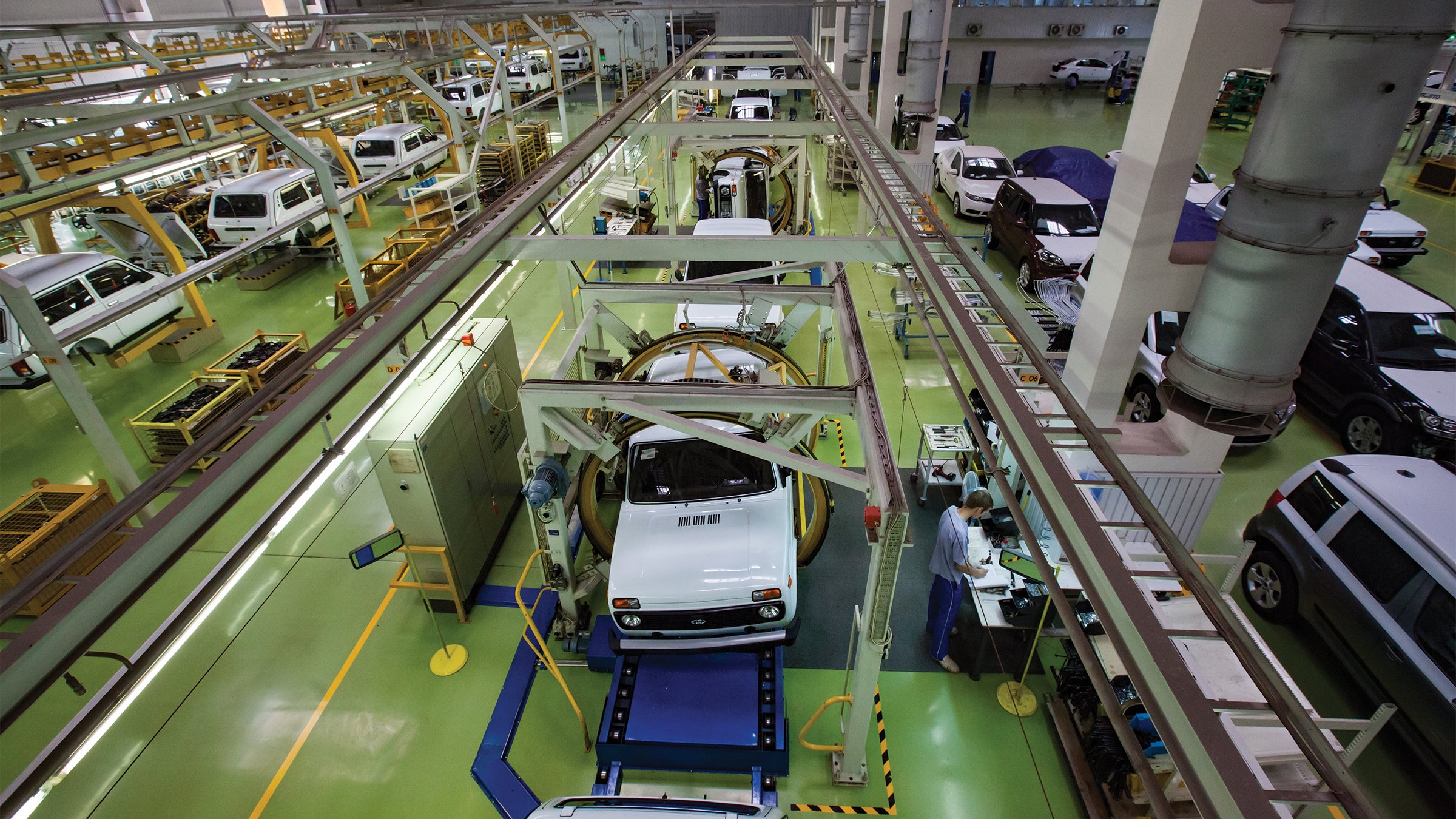 View from above of an automotive conveyor line in Asian auto-building plant.