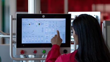 Woman using hmi touchscreen