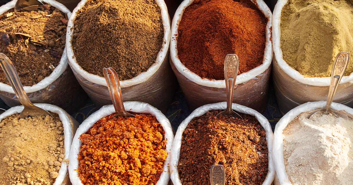 open bags of dry foods and spices top view