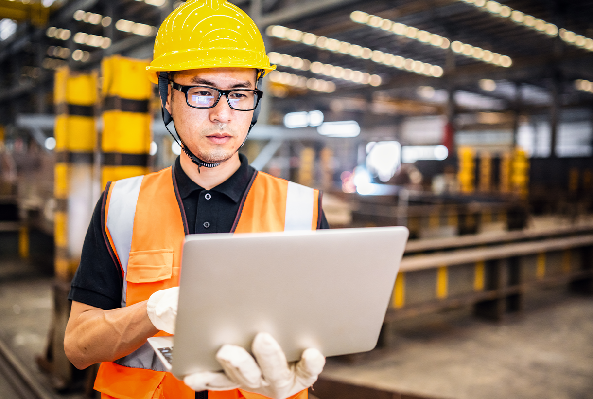 Plant Worker with Laptop Computer